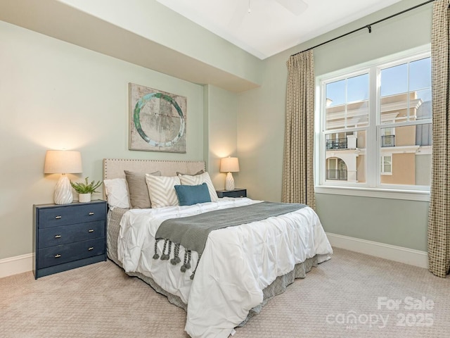 carpeted bedroom with ceiling fan