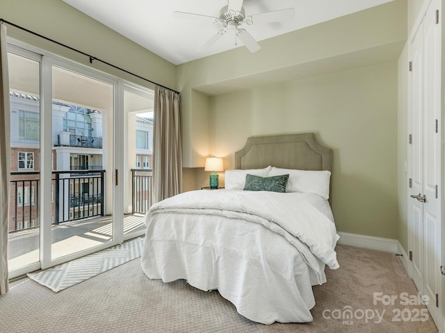 bedroom with ceiling fan, carpet flooring, access to exterior, and multiple windows