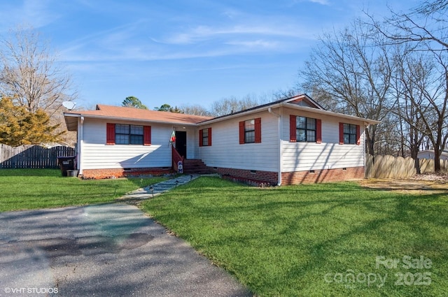 single story home featuring a front lawn