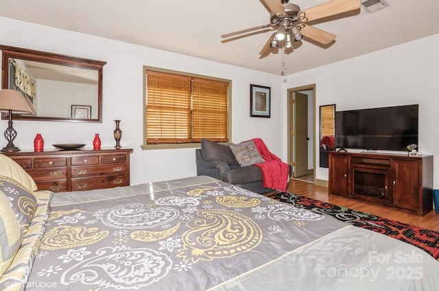 bedroom featuring wood-type flooring and ceiling fan