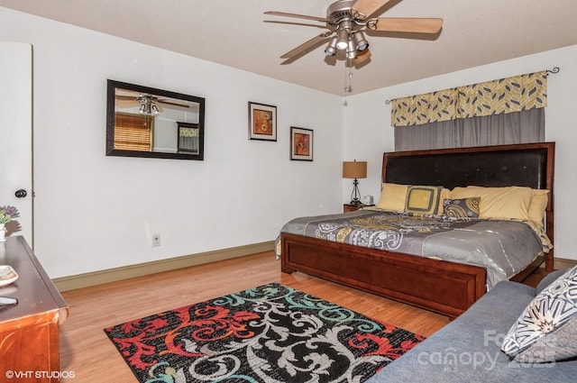 bedroom featuring wood-type flooring and ceiling fan