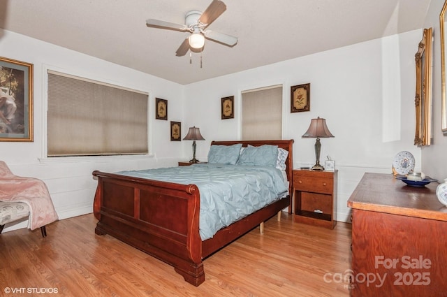 bedroom featuring light hardwood / wood-style floors and ceiling fan