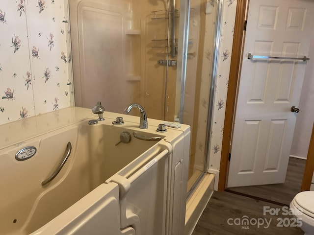 clothes washing area featuring dark hardwood / wood-style floors