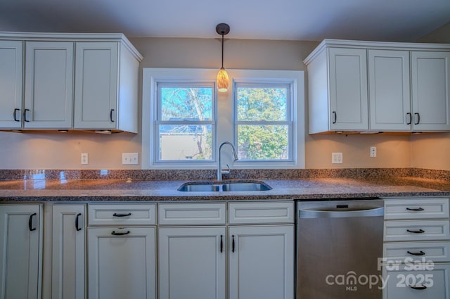 kitchen with white cabinetry, dishwasher, dark stone counters, pendant lighting, and sink