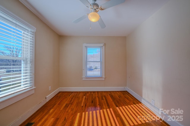 unfurnished room featuring ceiling fan and wood-type flooring