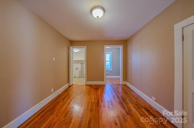 spare room featuring hardwood / wood-style flooring