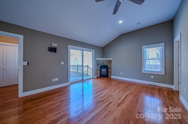 unfurnished living room featuring vaulted ceiling, ceiling fan, and light hardwood / wood-style flooring