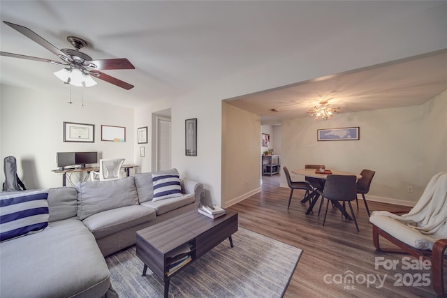 living room with ceiling fan and hardwood / wood-style floors