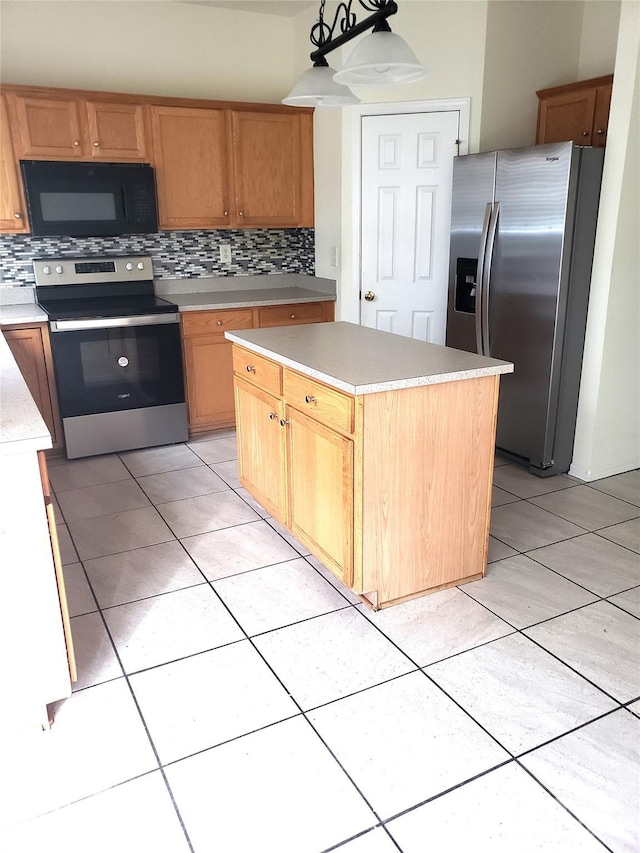 kitchen featuring backsplash, hanging light fixtures, appliances with stainless steel finishes, and a kitchen island