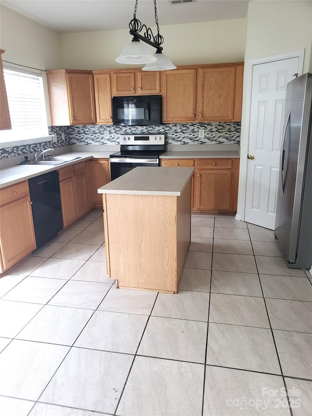 kitchen with decorative light fixtures, tasteful backsplash, a center island, black appliances, and light tile patterned floors