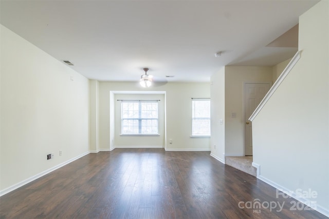 spare room featuring dark hardwood / wood-style flooring