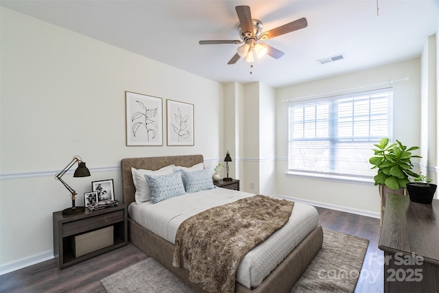 bedroom with ceiling fan and dark hardwood / wood-style flooring