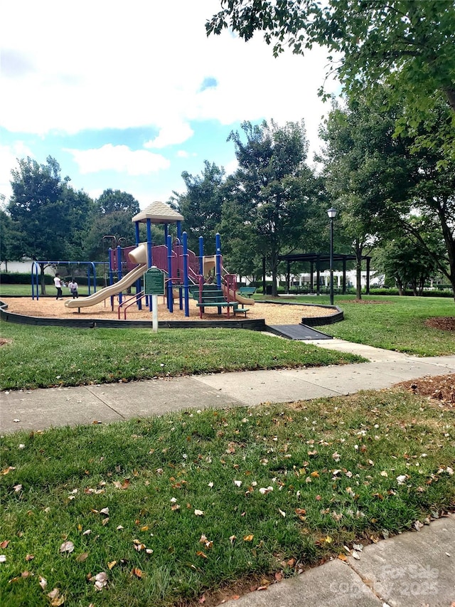 view of play area featuring a lawn