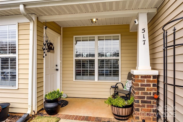 view of exterior entry with covered porch