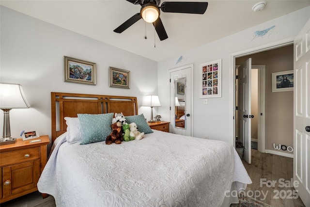 bedroom featuring ceiling fan and wood-type flooring