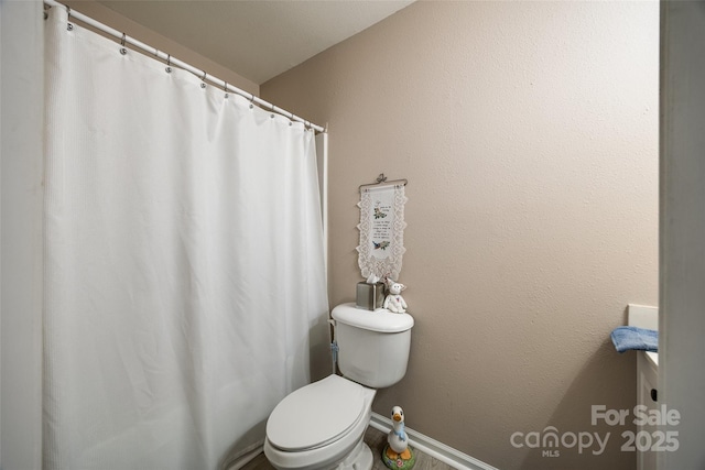 bathroom featuring toilet