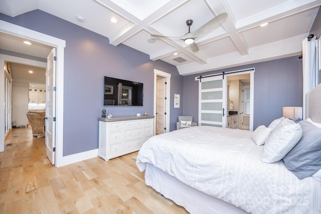 bedroom with ceiling fan, ensuite bathroom, a barn door, and coffered ceiling