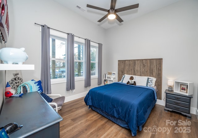 bedroom featuring ceiling fan and dark hardwood / wood-style floors