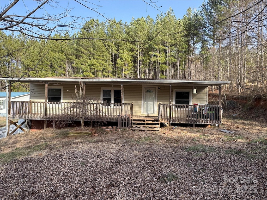 view of front of property featuring a wooden deck