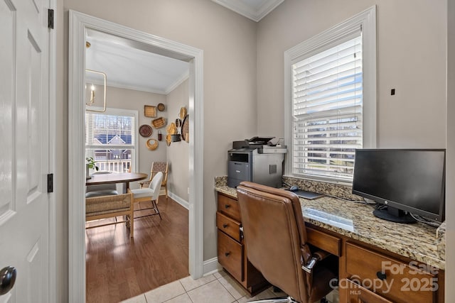 home office featuring ornamental molding and light tile patterned floors