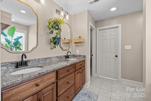 bathroom with vanity and tile patterned floors