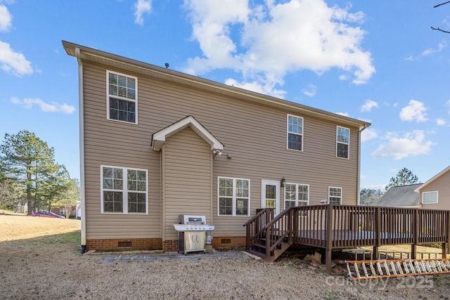 back of house with a wooden deck