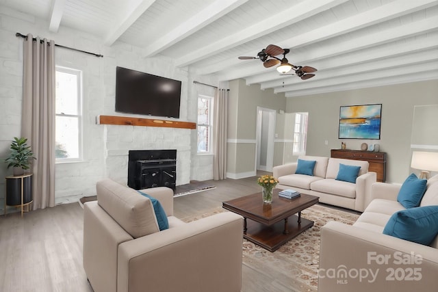 living room with beam ceiling, ceiling fan, and light hardwood / wood-style flooring