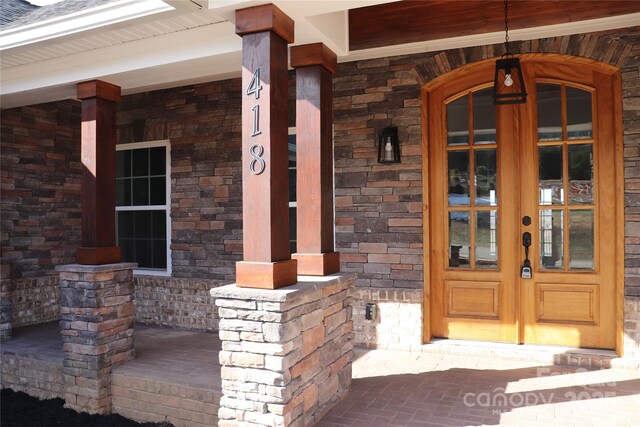 property entrance featuring french doors