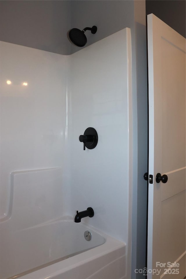 bathroom with shower / tub combination