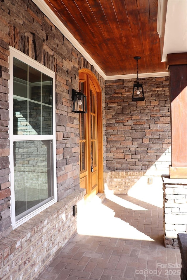 doorway to property featuring covered porch