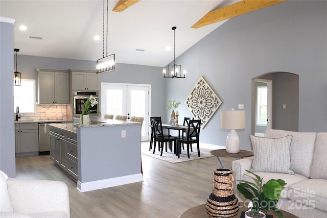 418 Huntington Woods St SE, Lenoir, NC 28645 - kitchen featuring gray cabinetry, dishwasher, high vaulted ceiling, beamed ceiling, and backsplash