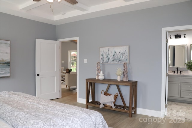 418 Huntington Woods St SE, Lenoir, NC 28645 - bedroom featuring coffered ceiling, light wood finished floors, beamed ceiling, ensuite bathroom, and baseboards