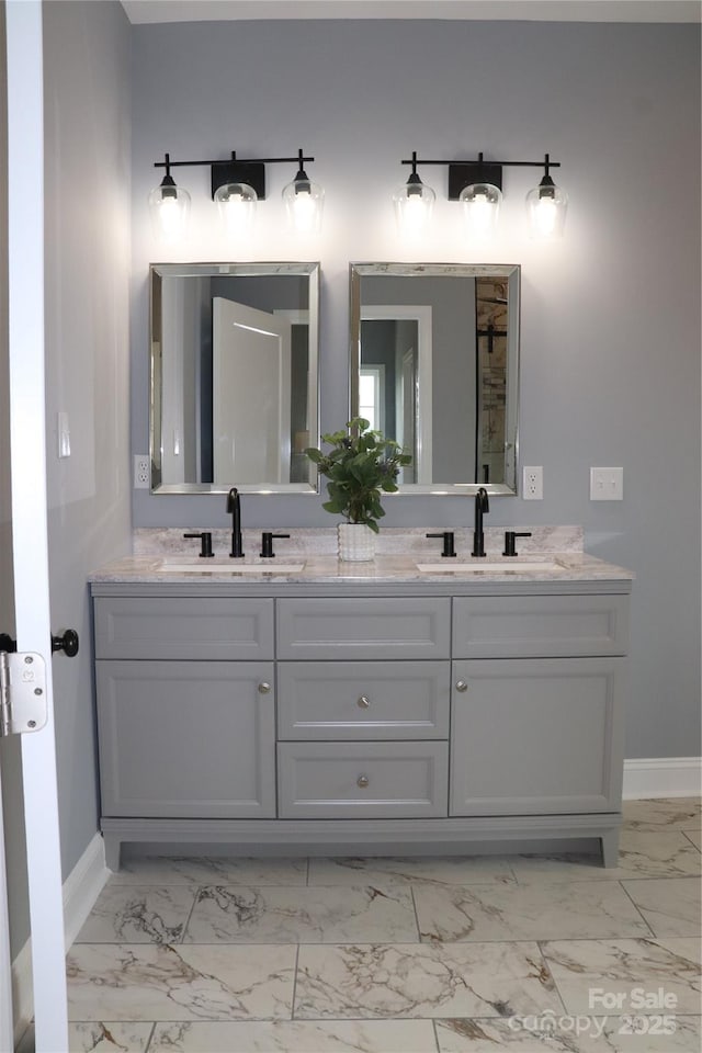 418 Huntington Woods St SE, Lenoir, NC 28645 - full bathroom with baseboards, marble finish floors, and double vanity