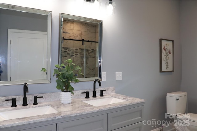 418 Huntington Woods St SE, Lenoir, NC 28645 - bathroom featuring toilet, a shower stall, and double vanity