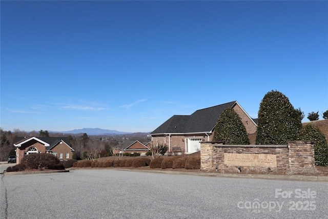 418 Huntington Woods St SE, Lenoir, NC 28645 - view of asphalt road with curbs and a mountain view