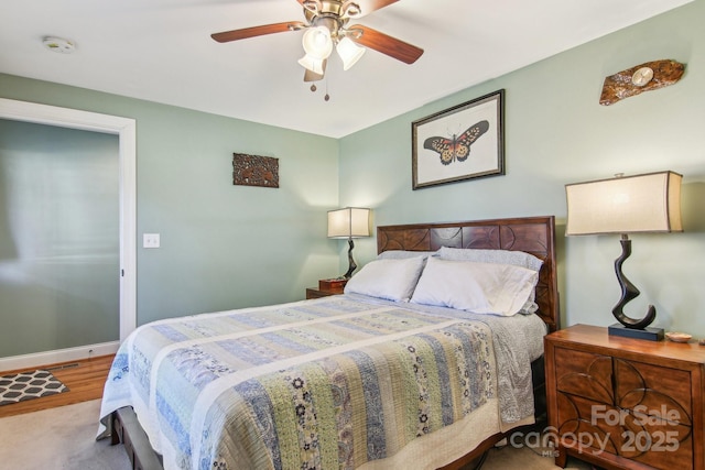 bedroom featuring ceiling fan and wood-type flooring