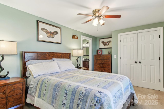 bedroom featuring ceiling fan, light colored carpet, and a closet