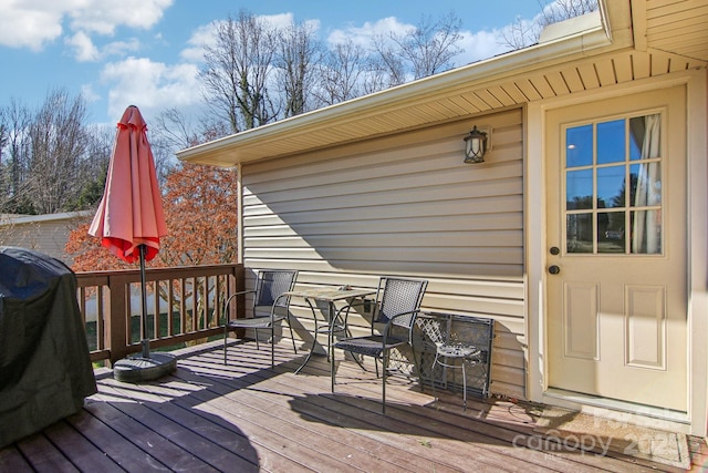 wooden terrace featuring grilling area