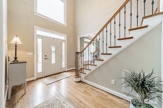 foyer with light hardwood / wood-style floors