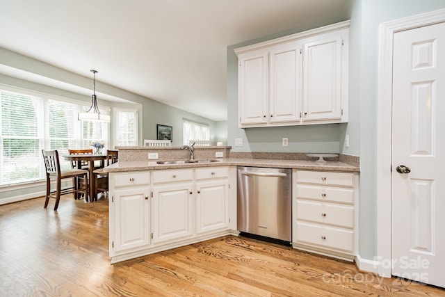 kitchen featuring white cabinetry, light hardwood / wood-style floors, dishwasher, and sink