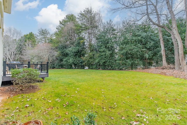 view of yard with a deck