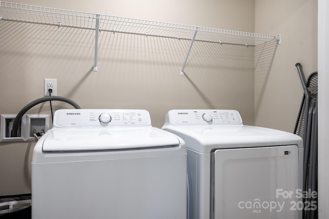 washroom with independent washer and dryer