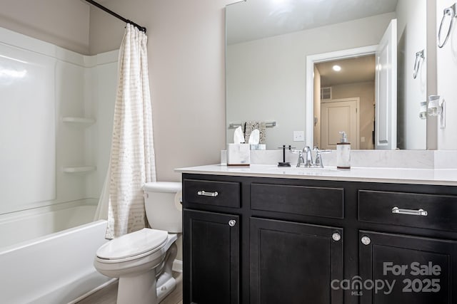 full bathroom featuring vanity, toilet, and shower / tub combo