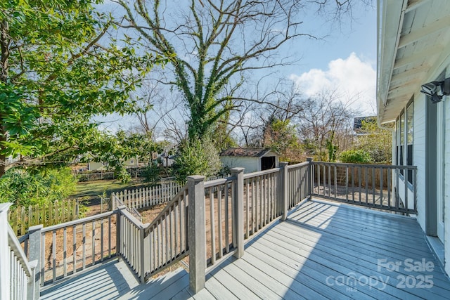 wooden terrace with a storage unit