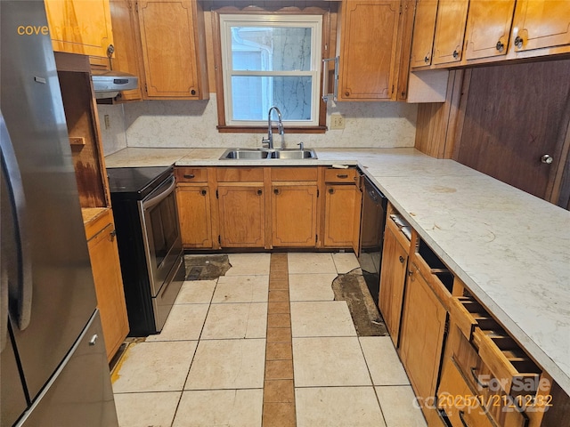 kitchen featuring light tile patterned floors, appliances with stainless steel finishes, ventilation hood, and sink