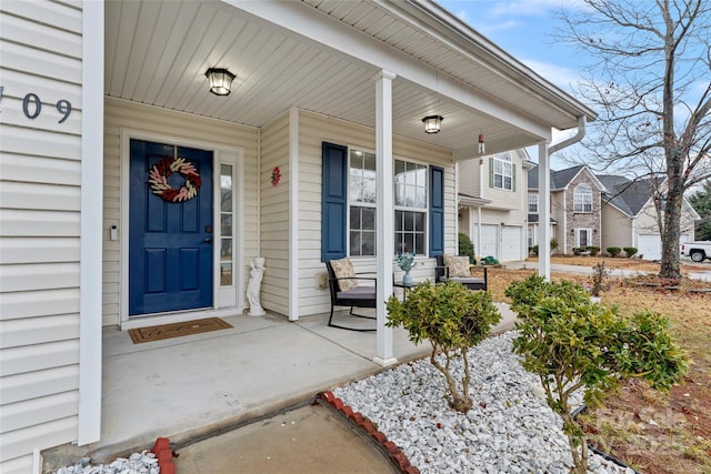 property entrance with a garage and a porch