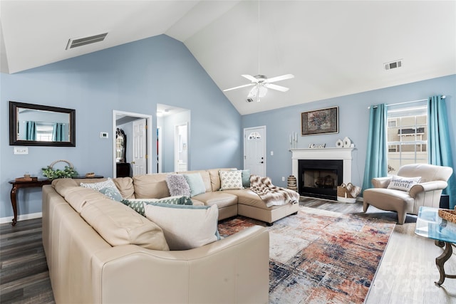 living room featuring high vaulted ceiling, hardwood / wood-style floors, and ceiling fan