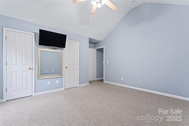 unfurnished bedroom with lofted ceiling, carpet floors, and ceiling fan