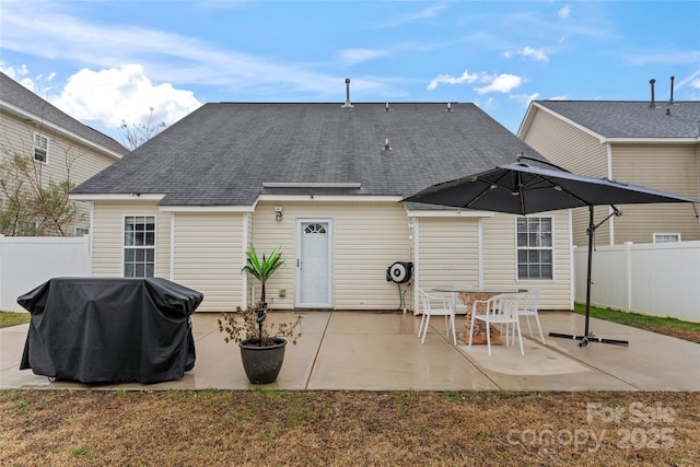 rear view of property featuring a patio area