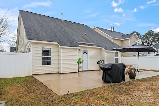 back of property with a patio